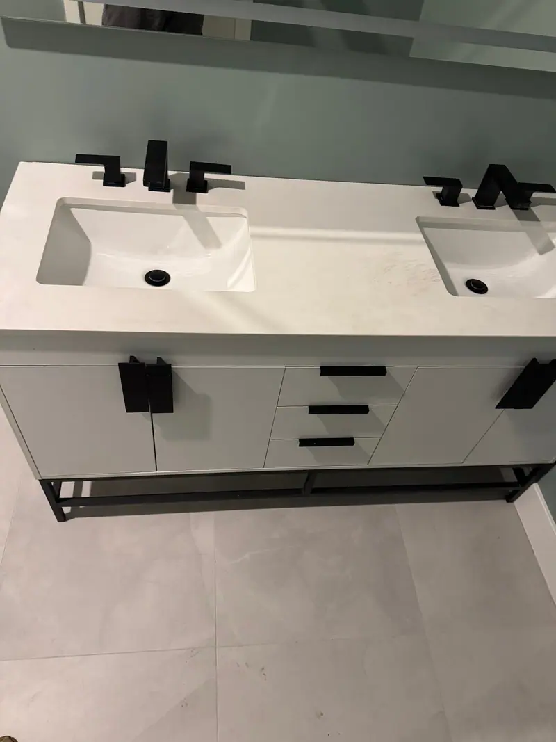 Double vanity with matte black faucets installed by AlbPlumbing