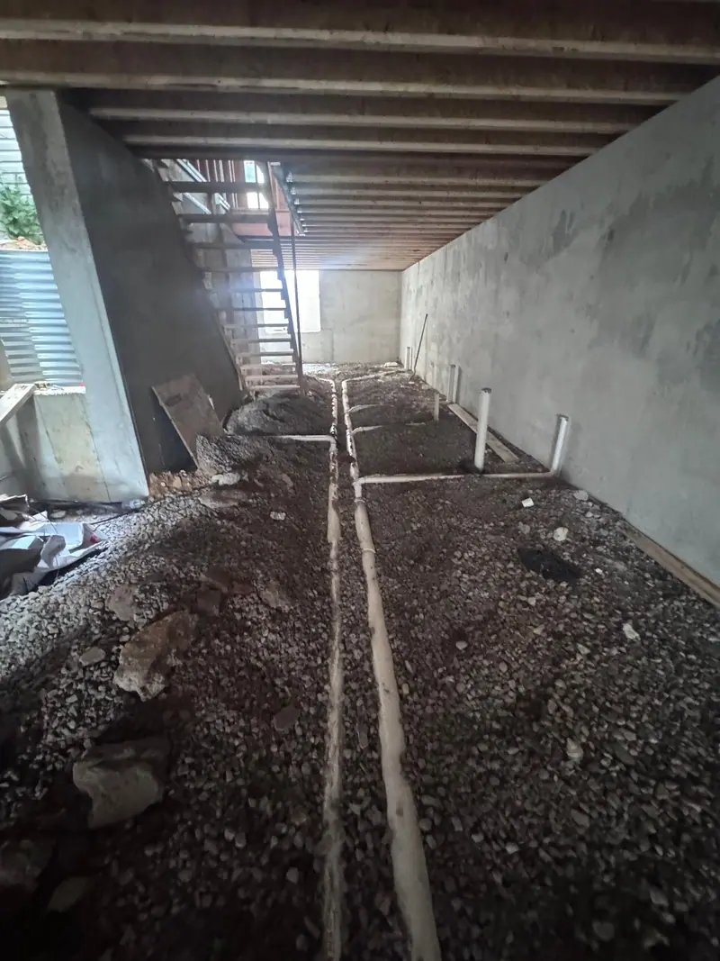 Underground plumbing rough-in under a new building