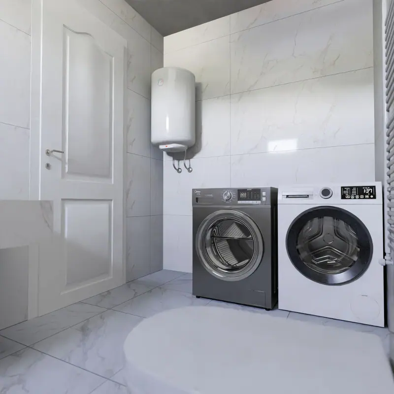 Wall mounted electric water heater above a washer and dryer