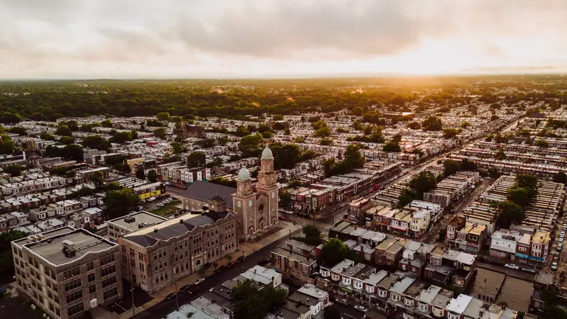 Philadelphia rowhome neighborhood and church at sunset