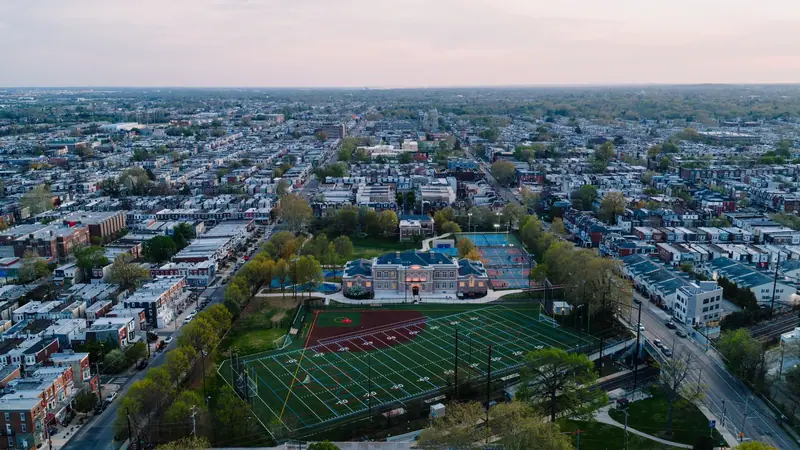 Aerial view of a Philadelphia neighborhood with a ball field at dusk